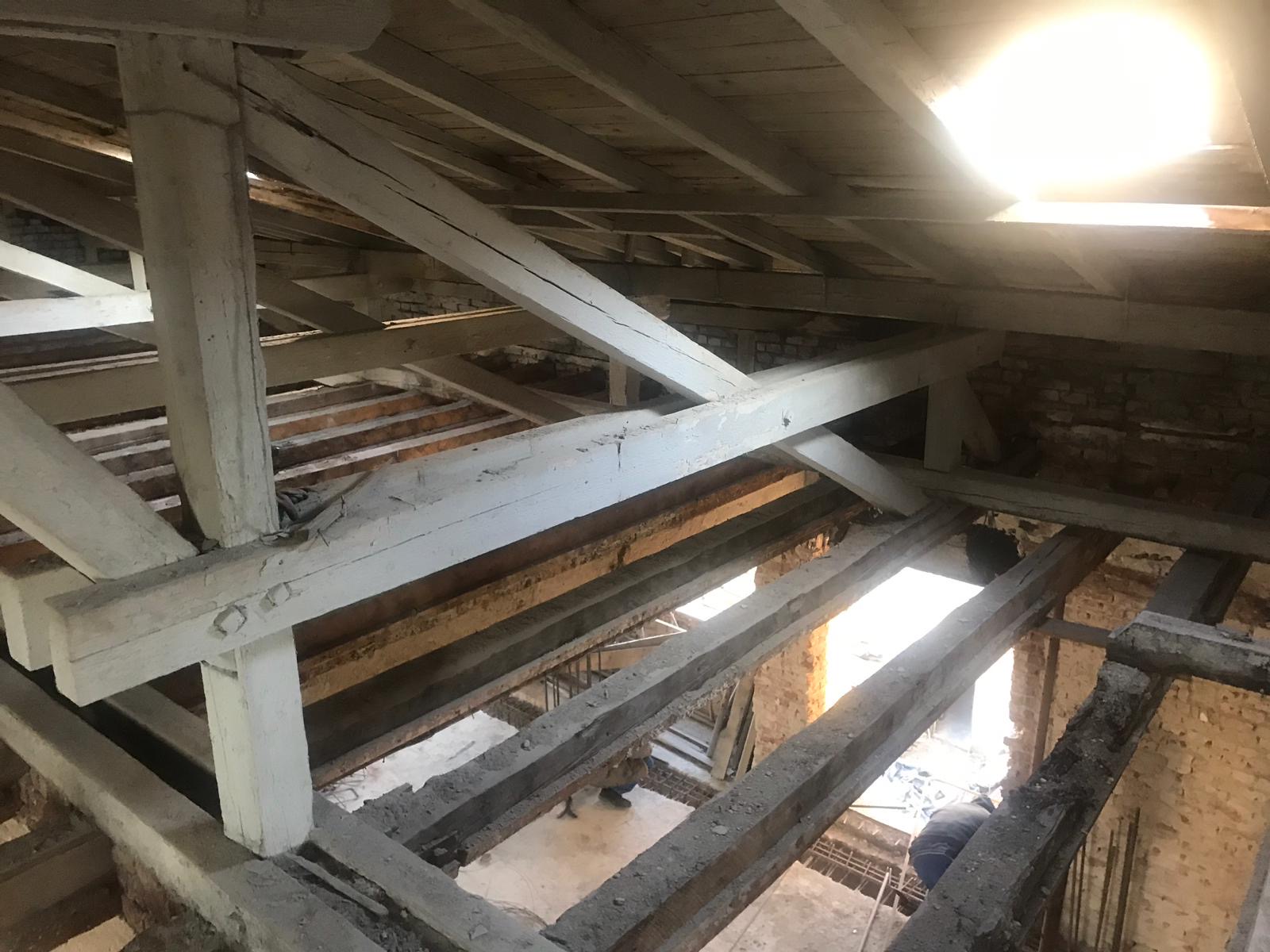 Original roof structure, antique hand hewn oak beams in situ before salvage