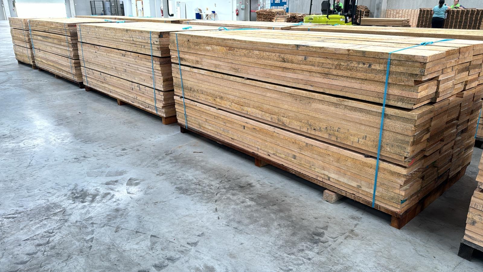 Large batch oak lumber palletized for B2B order review