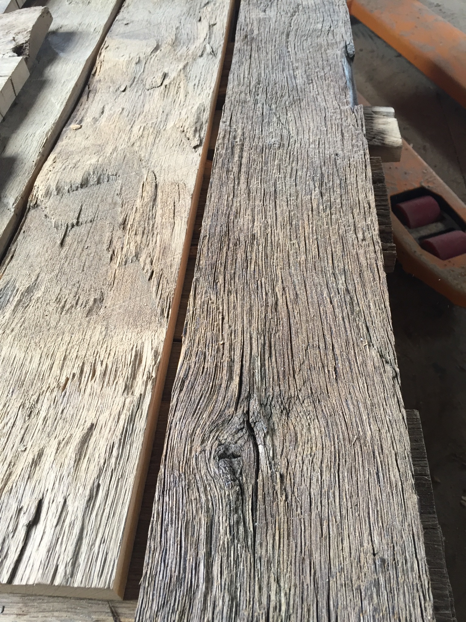 Close-up of reclaimed oak board surface with original texture and aged grain