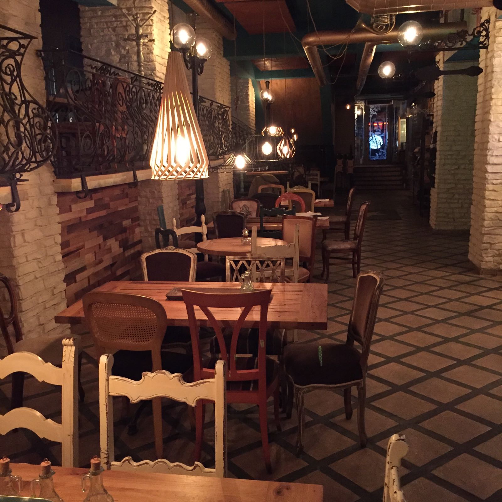 Restaurant hall, reclaimed oak tables with eclectic seating