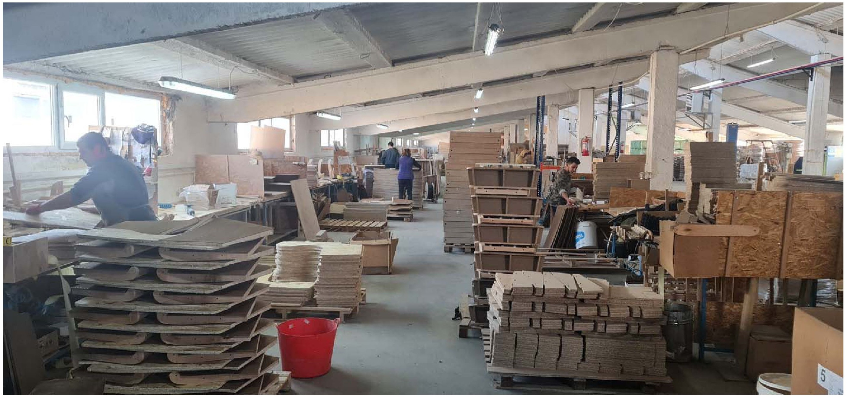 Sofa frame and upholstery assembly in a European workshop